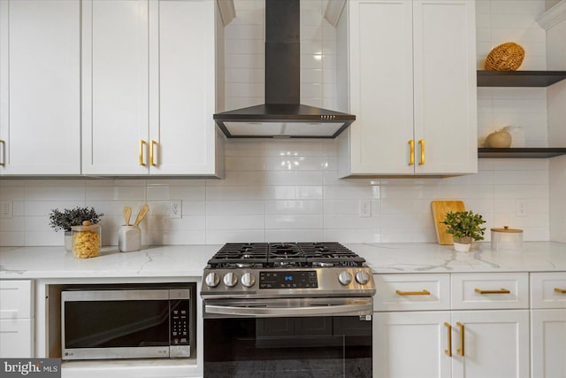 kitchen featuring open shelves, stainless steel appliances, wall chimney exhaust hood, and tasteful backsplash