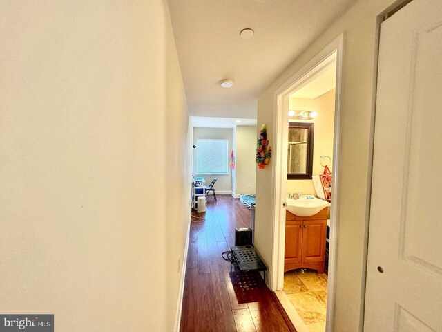 1431 N 17th St, Philadelphia, PA 19121 - hallway with hardwood / wood-style floors, a sink, and baseboards