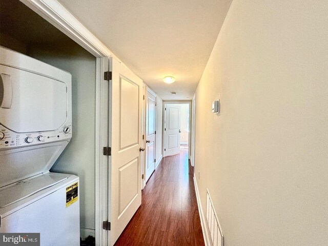 1431 N 17th St, Philadelphia, PA 19121 - laundry area with stacked washer / drying machine, dark wood finished floors, and baseboards