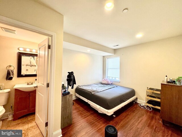1431 N 17th St, Philadelphia, PA 19121 - bedroom featuring a sink, baseboards, recessed lighting, and wood finished floors