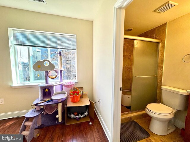 1431 N 17th St, Philadelphia, PA 19121 - bathroom with a stall shower, wood finished floors, toilet, and baseboards