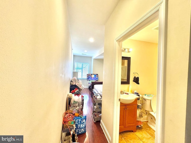 1431 N 17th St, Philadelphia, PA 19121 - corridor with a sink, light wood-style floors, and baseboards