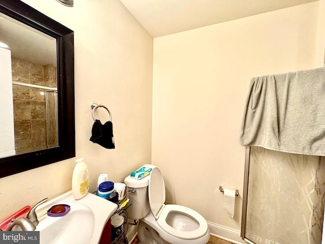 1431 N 17th St, Philadelphia, PA 19121 - bathroom with toilet, a sink, tiled shower, and baseboards