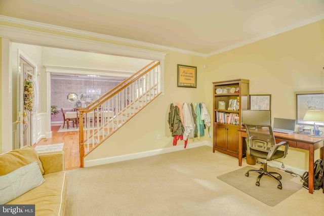 carpeted office space with ornamental molding, baseboards, and a chandelier