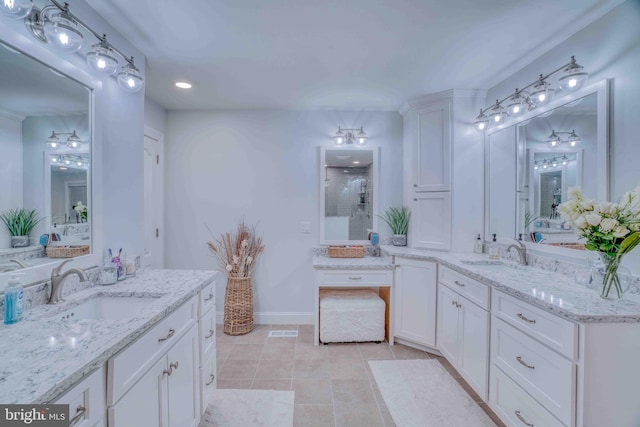 full bathroom featuring tile patterned flooring, a shower, baseboards, two vanities, and recessed lighting