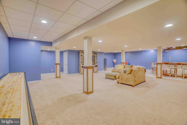 living area with carpet floors, bar area, a paneled ceiling, baseboards, and recessed lighting