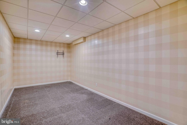 carpeted spare room with a paneled ceiling, recessed lighting, and baseboards