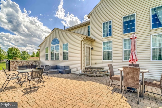 view of patio featuring outdoor dining space and outdoor lounge area