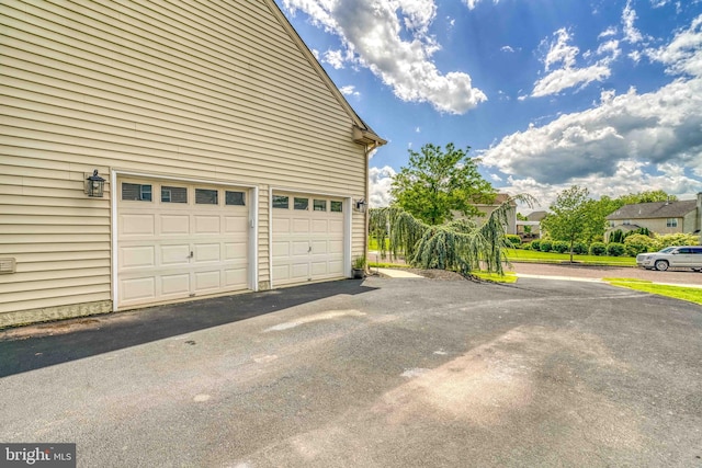 garage featuring driveway