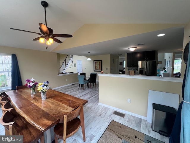 23 Cardinal Ln, Sicklerville, NJ 08081 - dining room with vaulted ceiling, stairway, light wood-style flooring, healthy amount of natural light, and baseboards