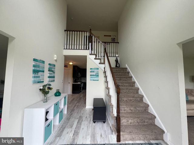 23 Cardinal Ln, Sicklerville, NJ 08081 - stairs featuring wood finished floors, baseboards, and a high ceiling