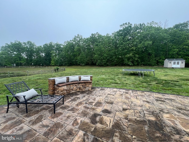 23 Cardinal Ln, Sicklerville, NJ 08081 - view of patio with a trampoline and an outbuilding