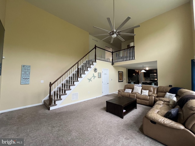 23 Cardinal Ln, Sicklerville, NJ 08081 - living room featuring a towering ceiling, ceiling fan, stairway, carpet floors, and baseboards