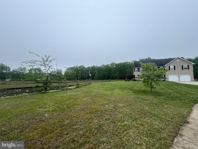 23 Cardinal Ln, Sicklerville, NJ 08081 - view of yard featuring a garage and driveway