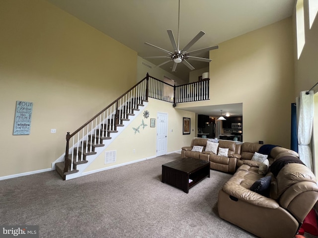 23 Cardinal Ln, Sicklerville, NJ 08081 - carpeted living room with a high ceiling, a ceiling fan, stairs, and baseboards