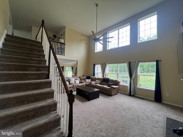 23 Cardinal Ln, Sicklerville, NJ 08081 - living room featuring a ceiling fan, stairs, carpet flooring, a high ceiling, and baseboards