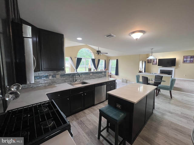 23 Cardinal Ln, Sicklerville, NJ 08081 - kitchen with a sink, dark cabinetry, dishwasher, tasteful backsplash, and light wood finished floors