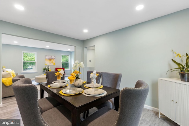 dining room featuring light wood-type flooring, recessed lighting, and baseboards