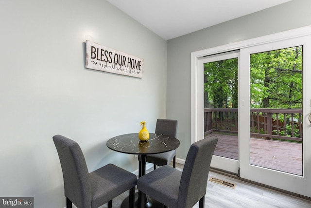 dining room with light wood finished floors