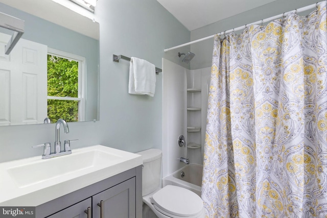 bathroom featuring toilet, vanity, and shower / tub combo with curtain
