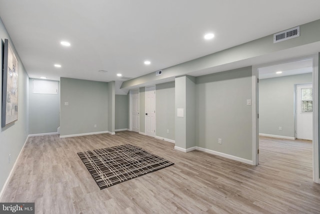 basement featuring wood finished floors, recessed lighting, and baseboards
