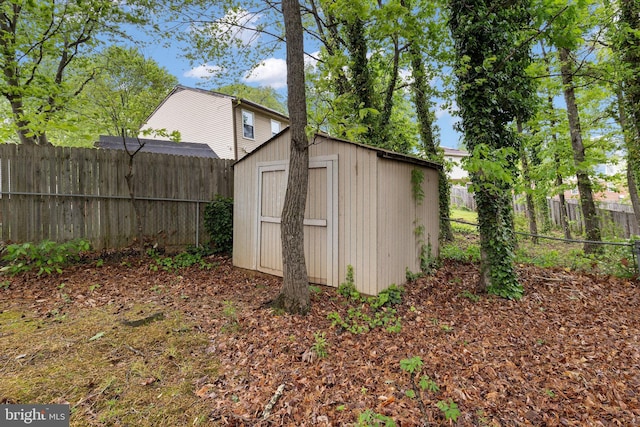 view of shed featuring a fenced backyard