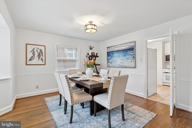 dining space featuring wood finished floors