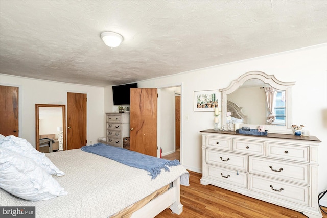 bedroom with light wood-type flooring