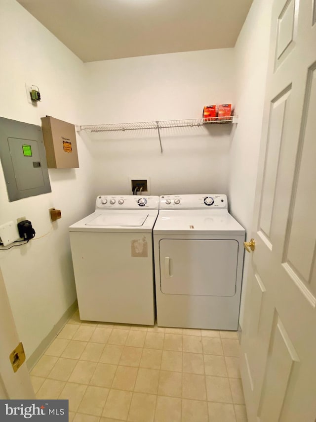 704 Dresher Woods Dr, Dresher, PA 19025 - washroom featuring electric panel, washing machine and dryer, and light tile patterned floors