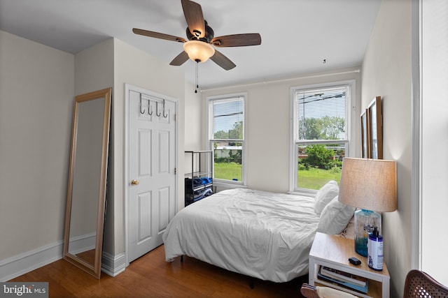 4734 Upland St, Philadelphia, PA 19143 - bedroom with wood finished floors, baseboards, and a ceiling fan