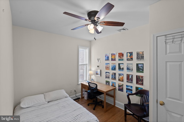 4734 Upland St, Philadelphia, PA 19143 - bedroom with dark wood-style flooring, baseboards, and a ceiling fan
