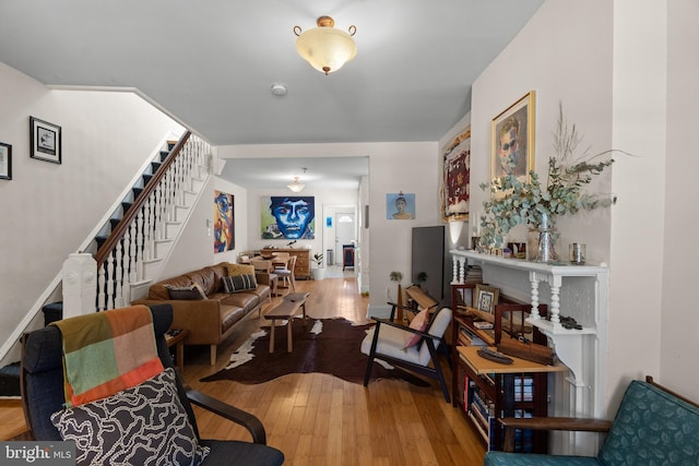 4734 Upland St, Philadelphia, PA 19143 - living room featuring stairway and hardwood / wood-style flooring