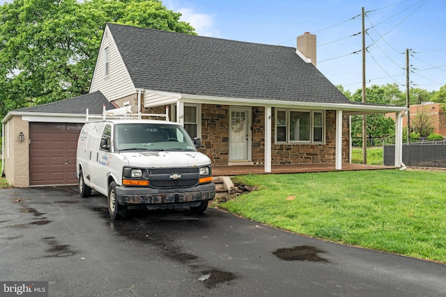 view of front of house with a shingled roof, driveway, a chimney, covered porch, and an attached garage