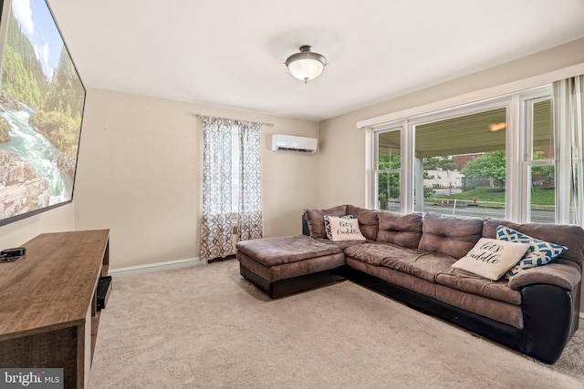 living area featuring carpet, plenty of natural light, a wall mounted AC, and baseboards