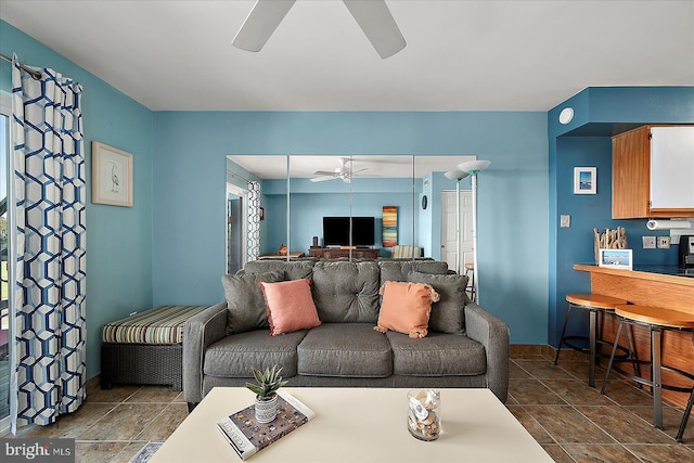 104 127th St Unit 326B, Ocean City, MD 21842 - living room with ceiling fan, dark tile patterned floors, and baseboards