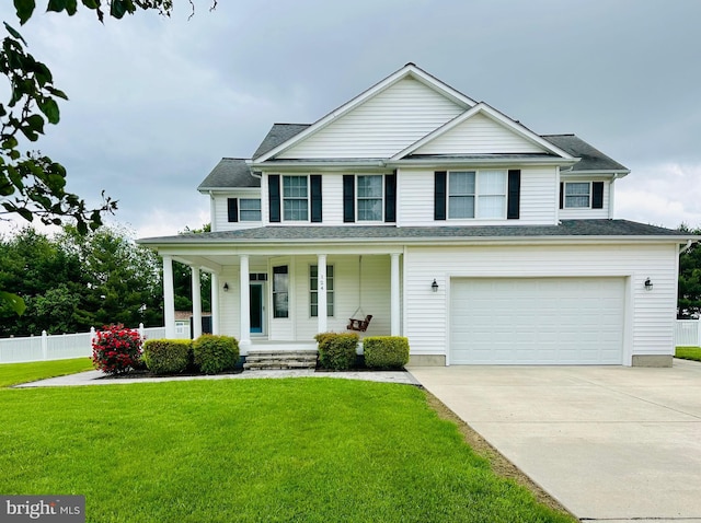 view of front of property featuring covered porch, an attached garage, and driveway