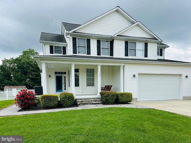 view of front of property featuring covered porch, concrete driveway, and a garage