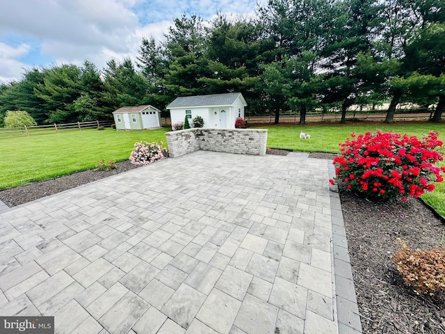 view of patio / terrace with an outbuilding