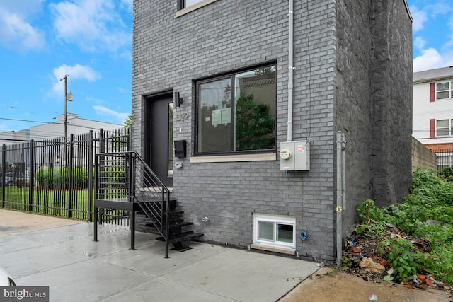 1309 S 32nd St, Philadelphia, PA 19146 - entrance to property featuring fence, a patio, and brick siding