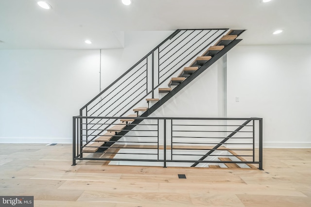 1309 S 32nd St, Philadelphia, PA 19146 - stairs featuring recessed lighting, baseboards, and wood finished floors