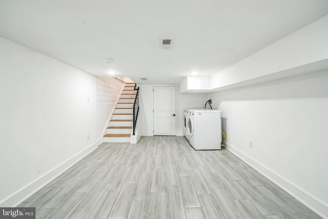 1309 S 32nd St, Philadelphia, PA 19146 - finished below grade area featuring washer / clothes dryer, light wood finished floors, and baseboards