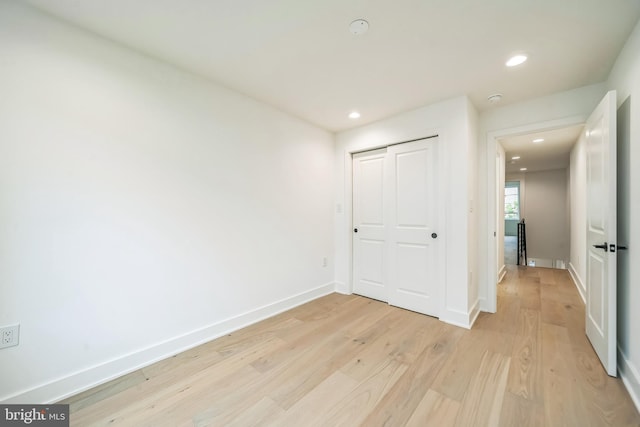 1309 S 32nd St, Philadelphia, PA 19146 - unfurnished bedroom with light wood finished floors, recessed lighting, baseboards, and a closet