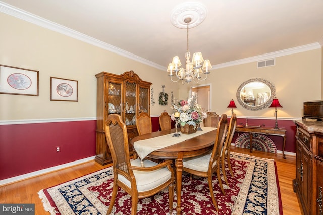 1280 Saint Michaels Rd, Mount Airy, MD 21771 - dining area with a chandelier, crown molding, light wood-type flooring, and baseboards