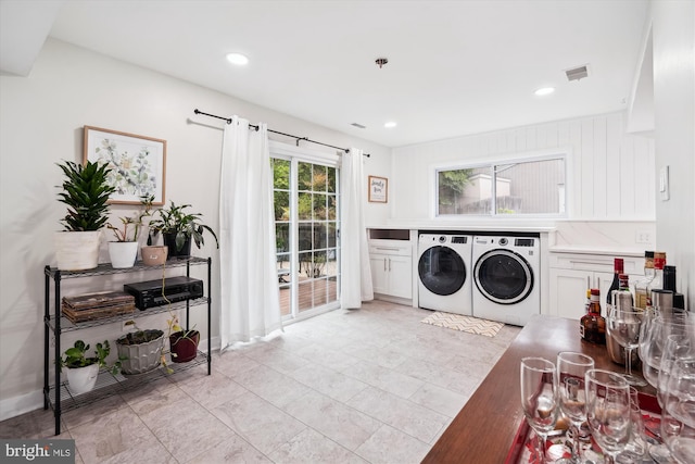 washroom featuring washer and clothes dryer, recessed lighting, cabinet space, and baseboards