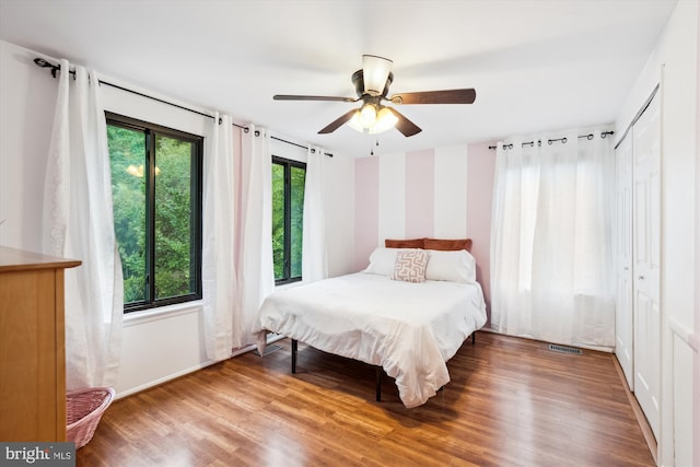 bedroom with wood finished floors and a ceiling fan