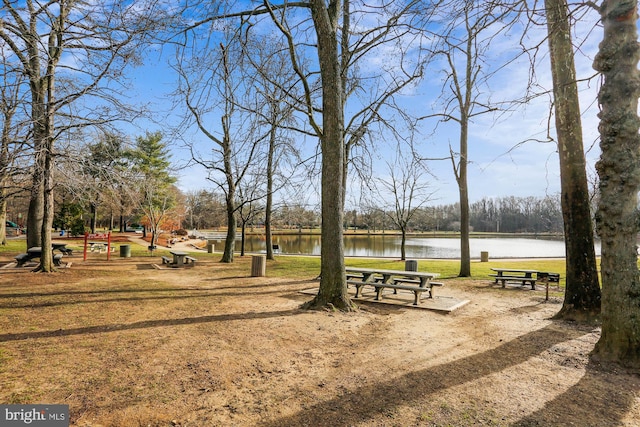 surrounding community with a water view
