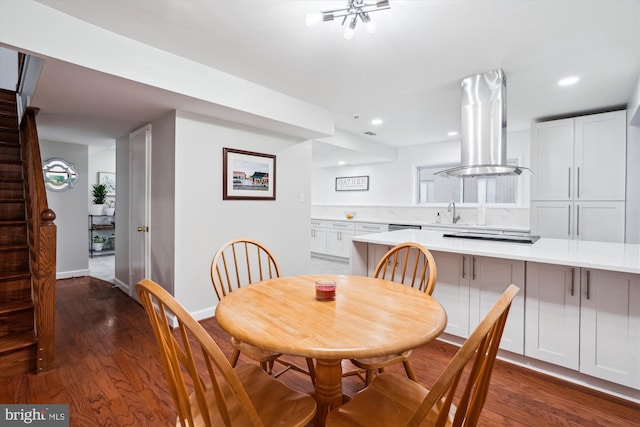 dining room featuring dark wood-style floors, baseboards, and recessed lighting