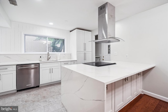 kitchen featuring stainless steel dishwasher, a sink, island exhaust hood, black electric stovetop, and a peninsula