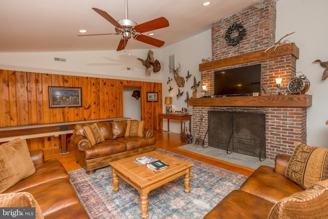 3706 Bestpitch Ferry Rd, Cambridge, MD 21613 - living area featuring wood finished floors, lofted ceiling, ceiling fan, a fireplace, and wooden walls