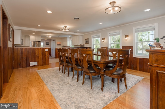 3706 Bestpitch Ferry Rd, Cambridge, MD 21613 - dining space with healthy amount of natural light, wainscoting, light wood-type flooring, recessed lighting, and ornamental molding